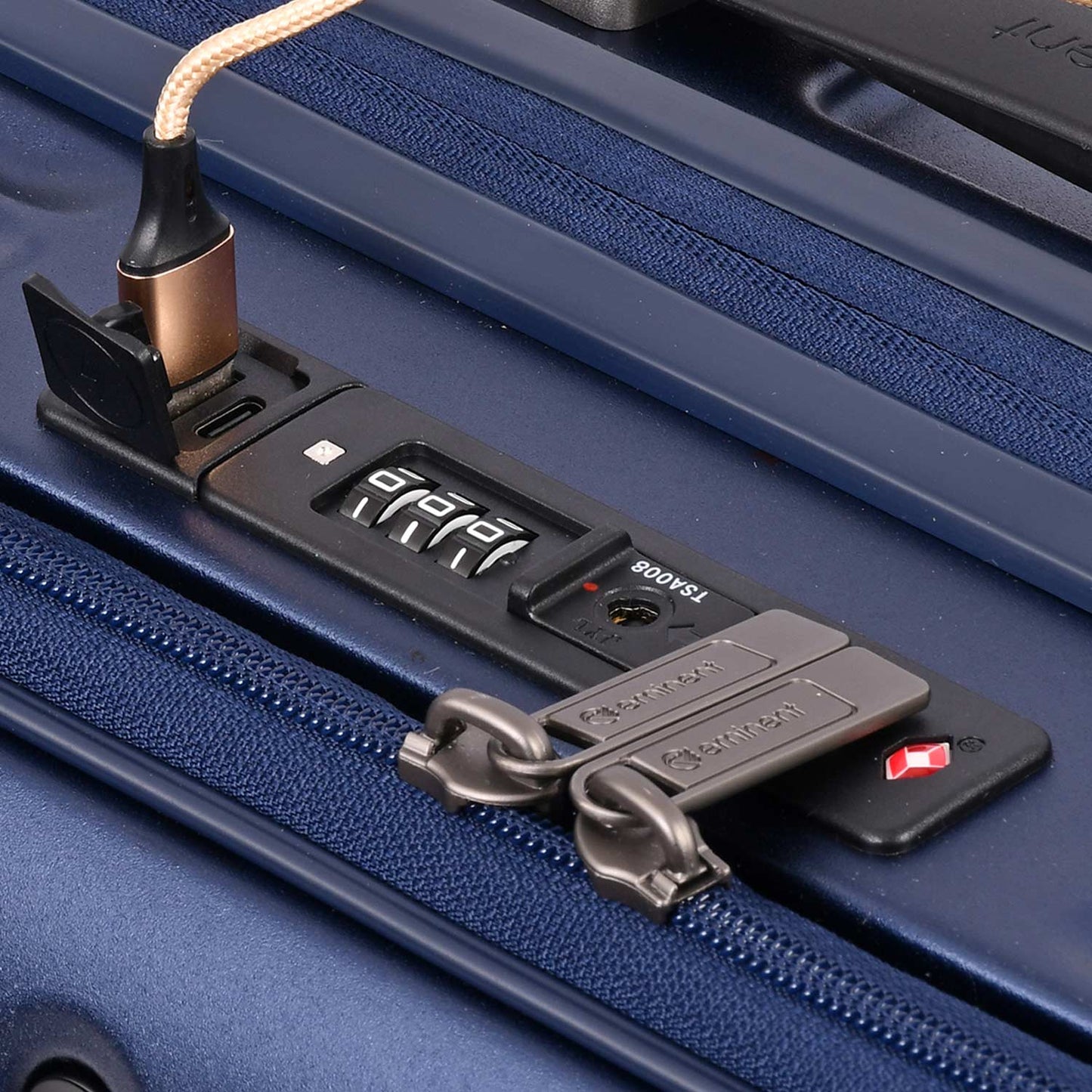 A dark blue, ribbed, hard-shell Eminent Alfred KK70 suitcase with a telescopic handle, spinner wheels, and a top carrying handle.