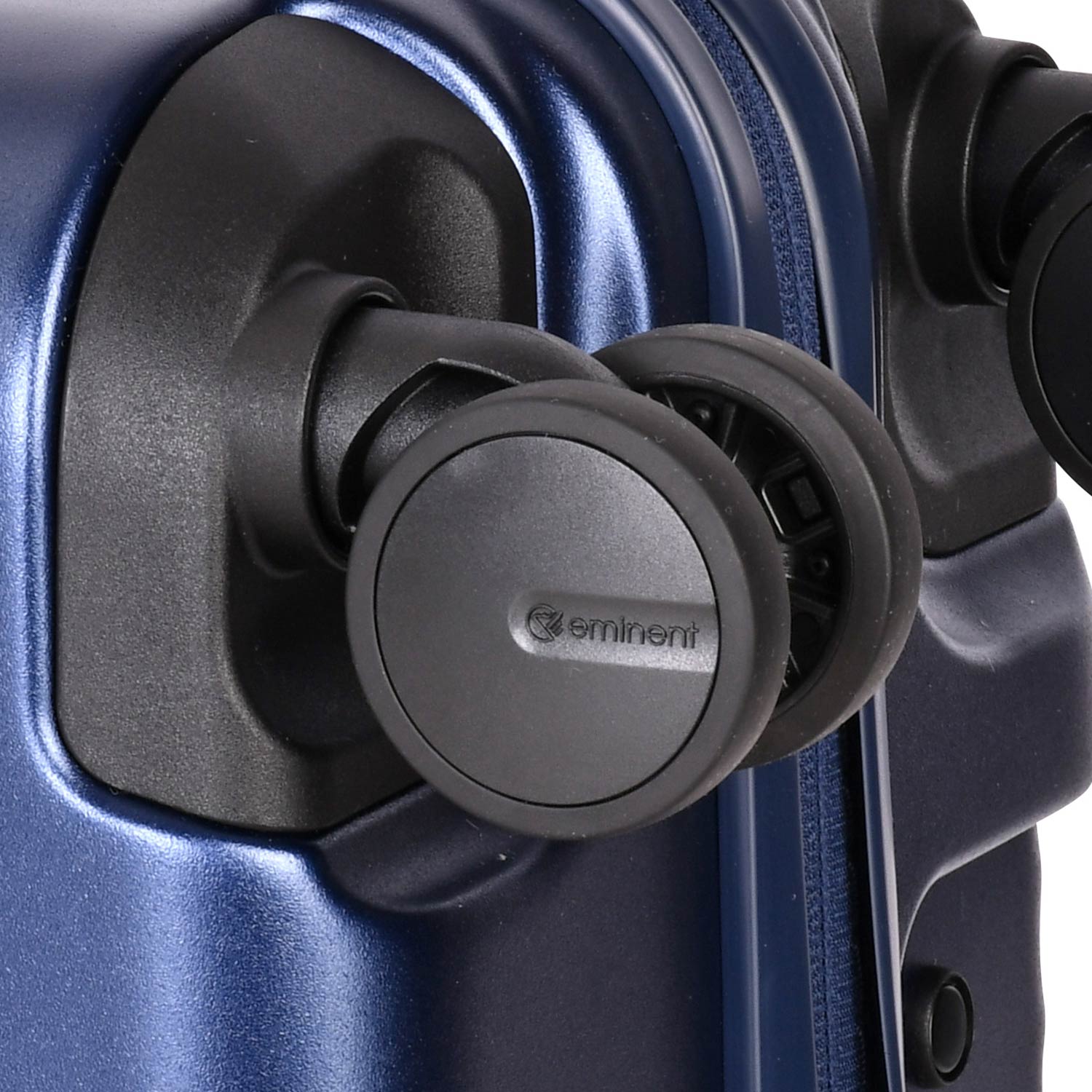 A dark blue, ribbed, hard-shell Eminent Alfred KK70 suitcase with a telescopic handle, spinner wheels, and a top carrying handle.
